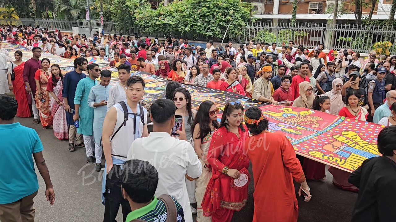 South Korean visitors enjoying Pohela Boishakh Mangal Shobhajatra in Bangladesh with vibrant cultural masks, traditional folk art, and lively Bengali New Year celebration — Bangladesh Guided Tours