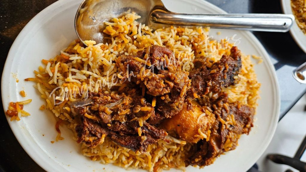 Traditional Kacchi Biryani served in Old Dhaka with tender mutton, fragrant basmati rice, and potato cooked in Mughlai dum style