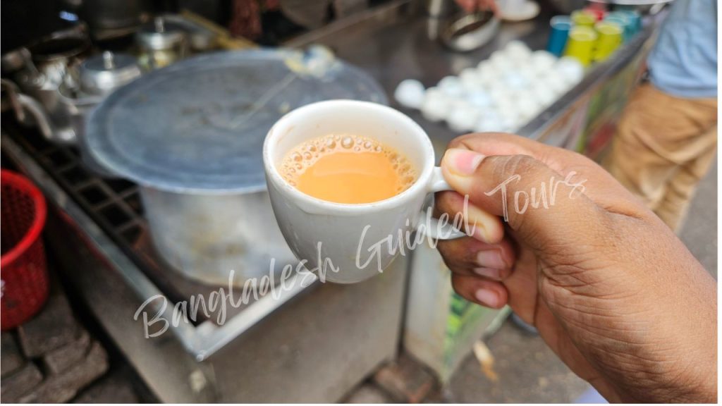 Traditional Khaati Gorur Dudher Cha served in Old Dhaka street stall, creamy milk tea made with fresh cow milk, black tea, and sugar in Bangladesh