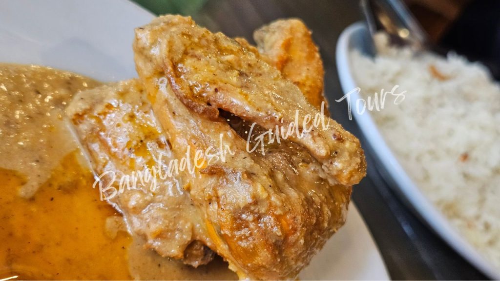 Traditional Morog Polao (whole chicken pilaf) served in Old Dhaka, aromatic basmati rice with tender chicken, a classic Bangladeshi wedding dish for foreign tourists