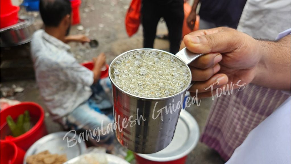 Refreshing aloe vera juice served by a street vendor in Old Dhaka, Bangladesh with fresh mint, lime, and traditional local flavors