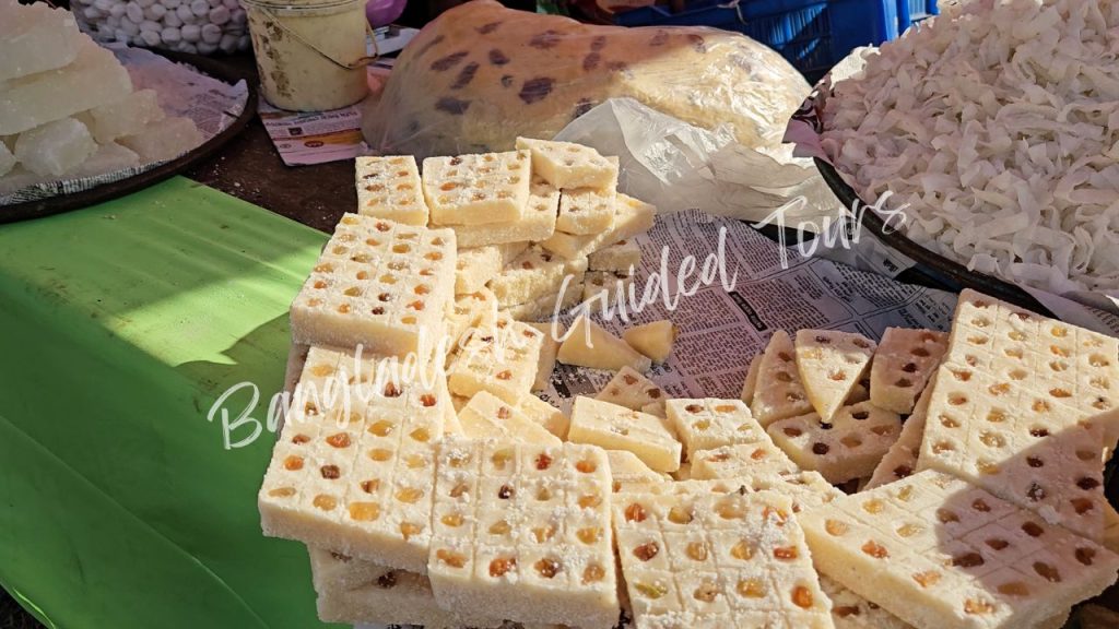 Traditional Sandesh sweet made from chhena and sugar served in Old Dhaka sweet shop, a classic Bengali cottage cheese dessert for foreign tourists in Bangladesh