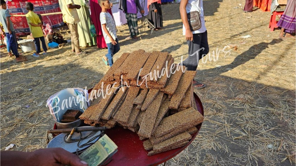 Traditional Tiler Khaja made with sesame seeds and jaggery, a crunchy Bengali street sweet snack from Old Dhaka for foreign tourists in Bangladesh
