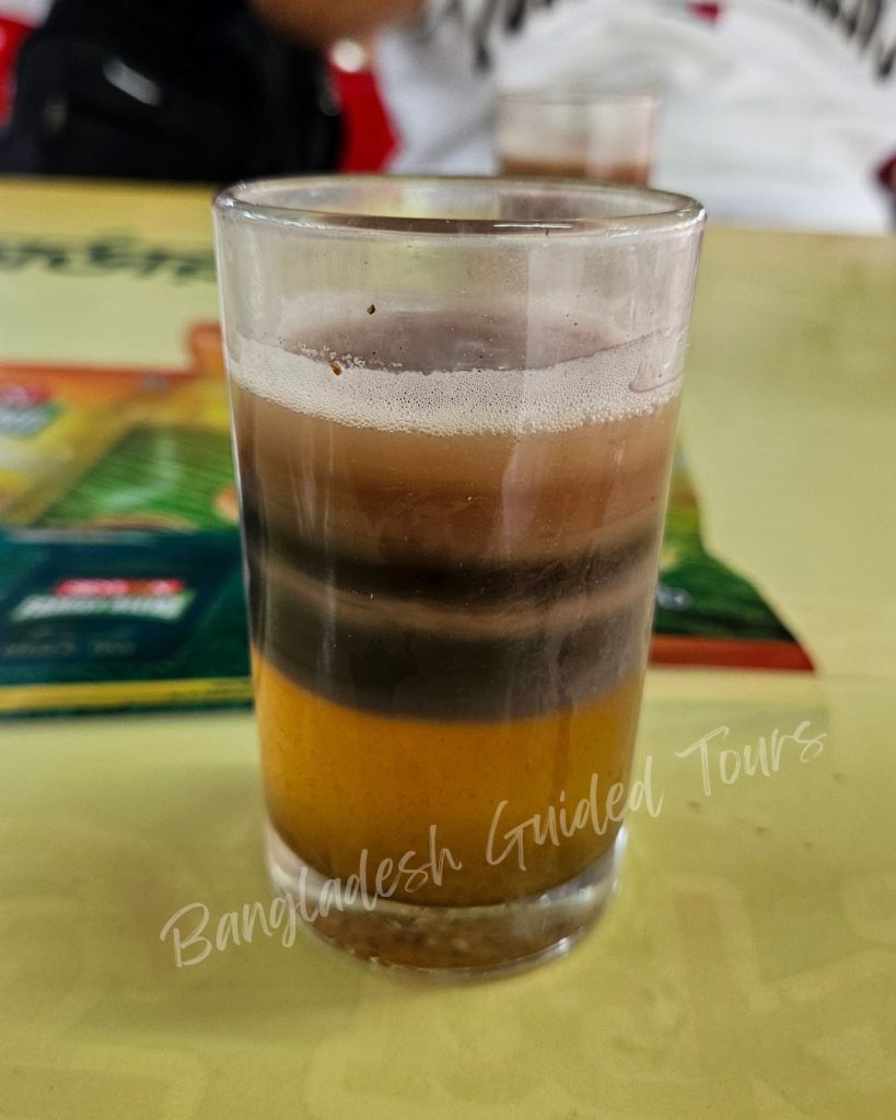 Seven Layer Tea in Sreemangal, Bangladesh, featuring seven colorful layers with unique flavors in a single glass.